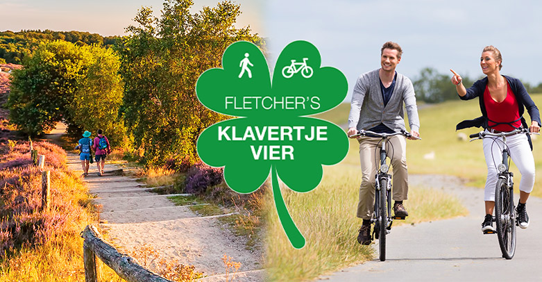 Fietsend stel in de natuur van Nederland