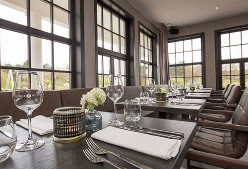 Interieur restaurant van Fletcher Boutique Hotel Duinoord